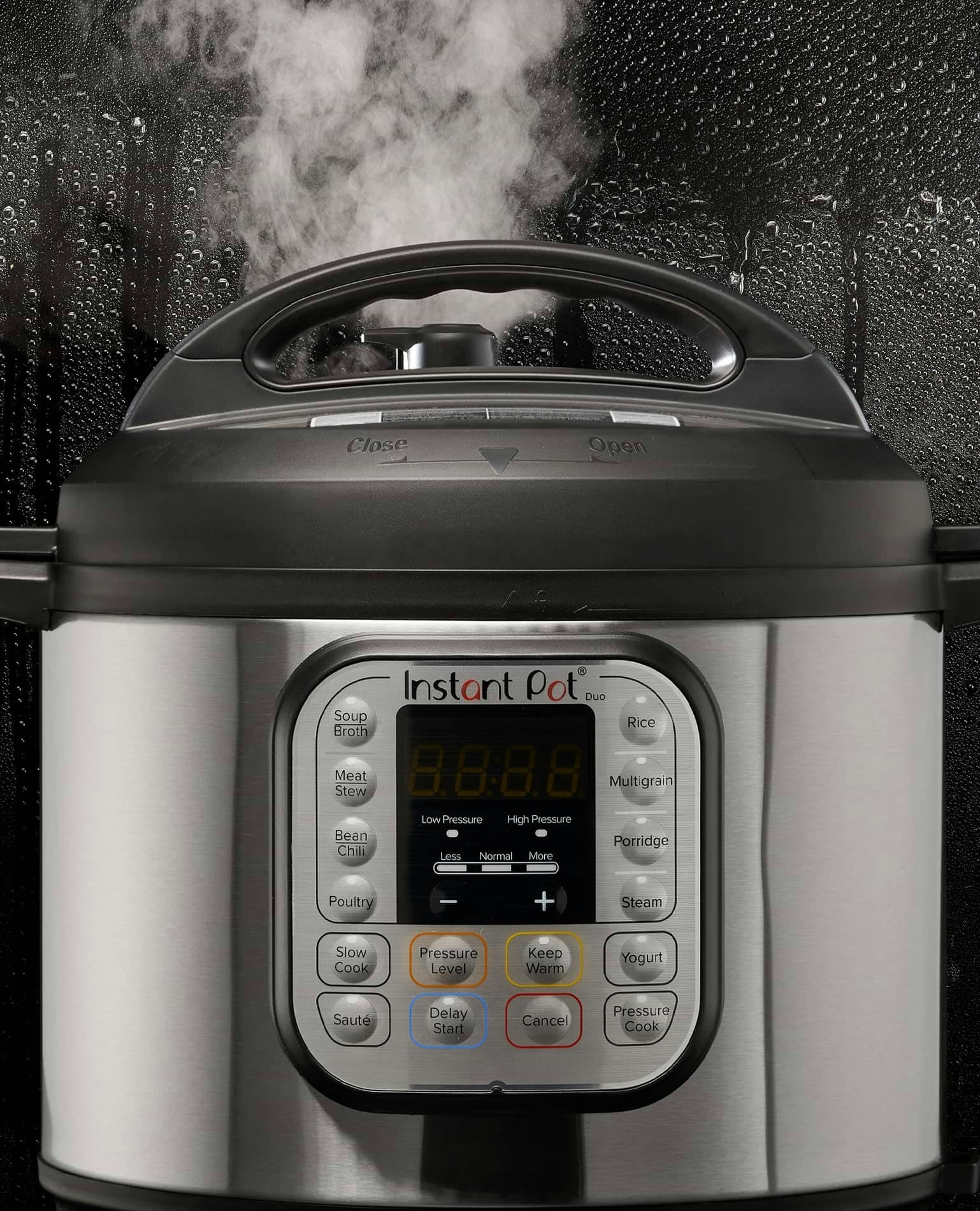 An instant pot blowing steam out the top.
